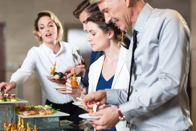 People-enjoying-cocktails-and-food-at-event