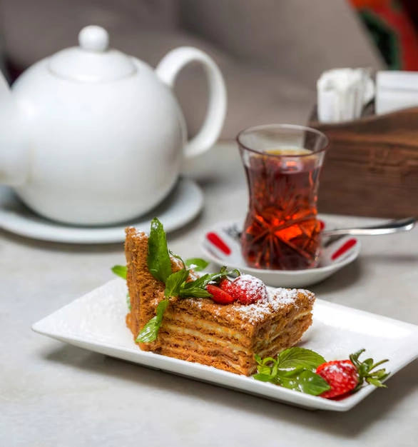 Tea-cup-and-cake-with-berries-on-plate